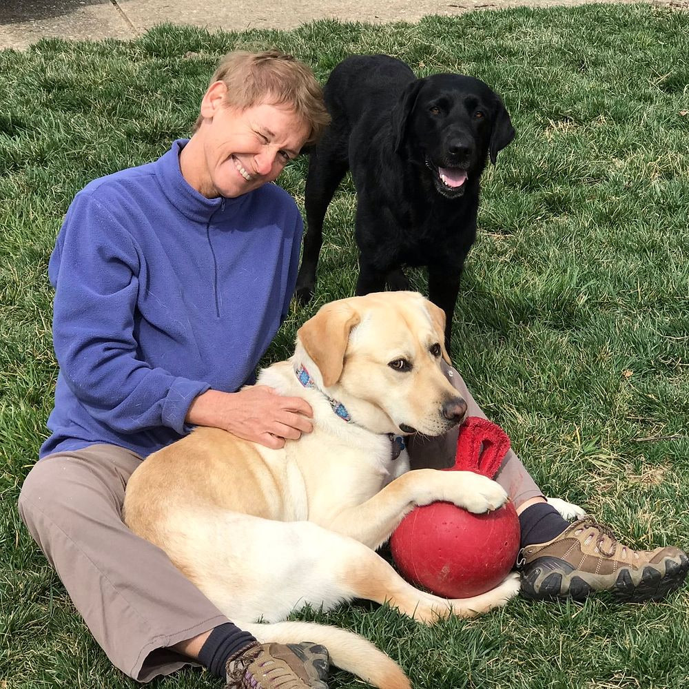 Eva Klenner sharing a relaxed moment with two dogs
